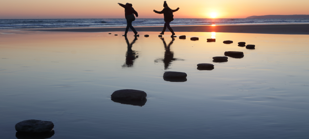 people rocks sea
