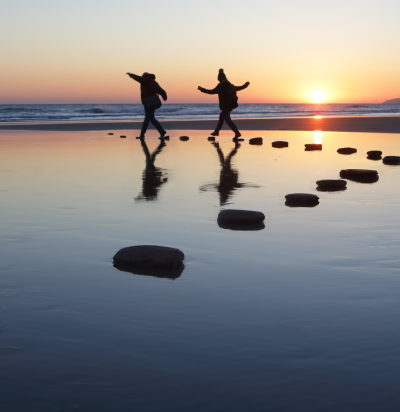 people rocks sea
