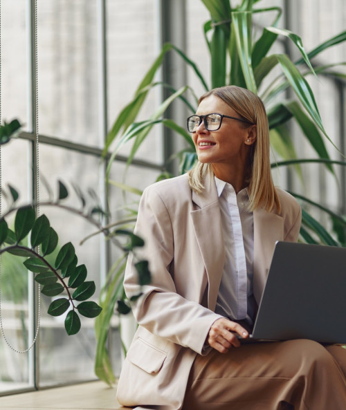 smiling woman programmer eyeglasses working on laptop