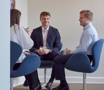 denmark-office-colleagues-sitting-talking 