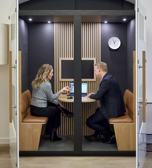 two-colleagues-sitting-having-meeting