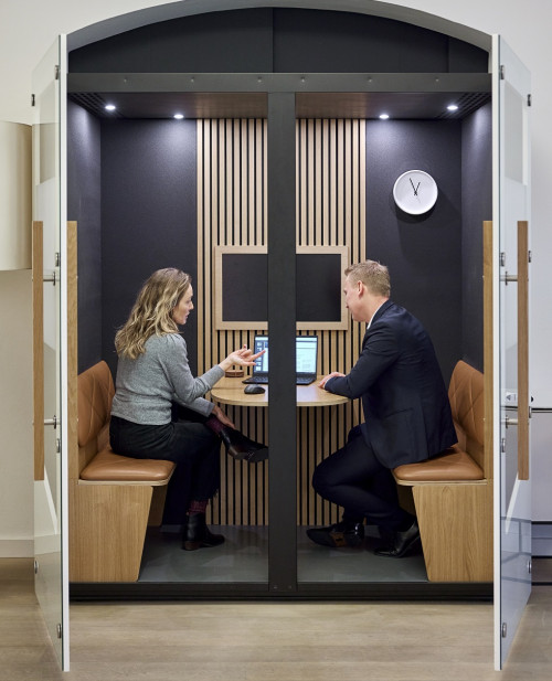 two-colleagues-sitting-having-meeting