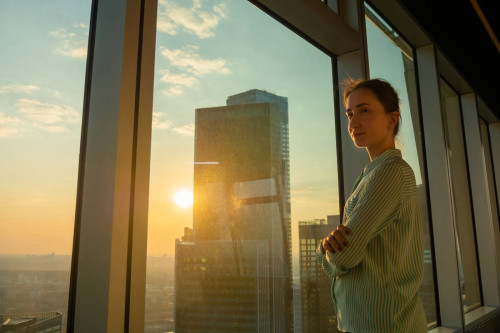 portrait smiling woman looking cityscape
