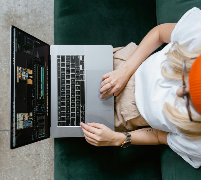 tech editing laptop woman
