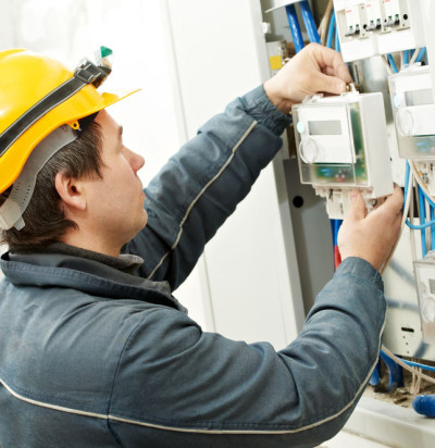 Electrician installing energy saving meter