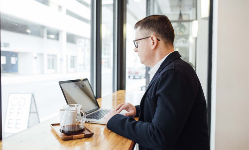 businessman working on plan cafe ML1