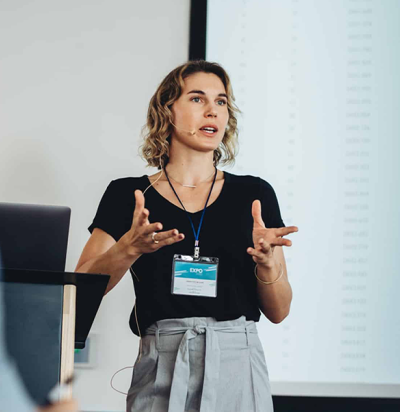 businesswoman delivering speech during conference ML1 v2