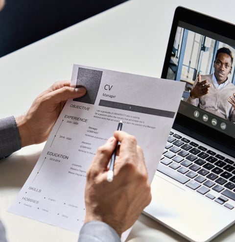 male hr recruiter employer holding cv