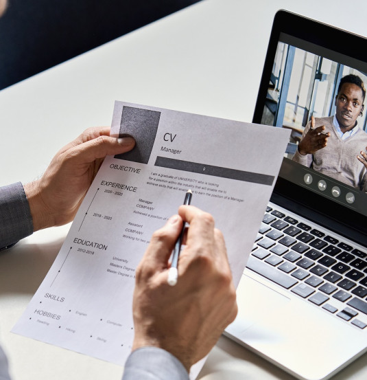 male hr recruiter employer holding cv