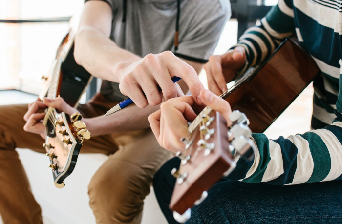 group small school kids teacher guitar