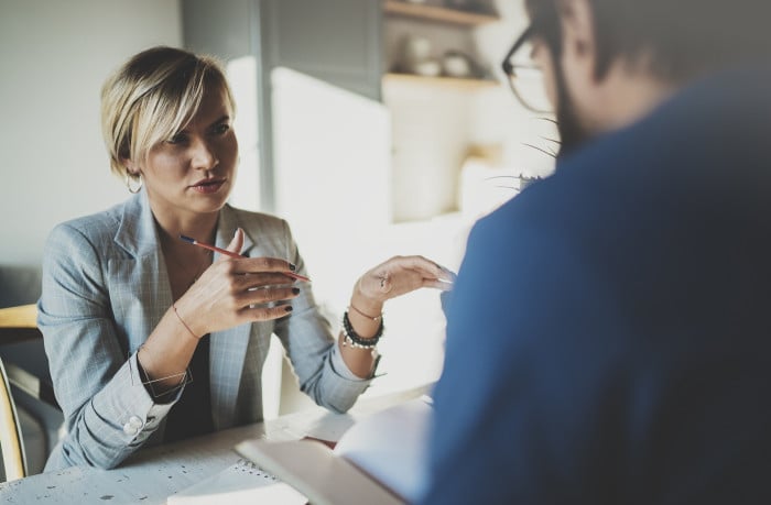 male hr recruiter employer holding cv