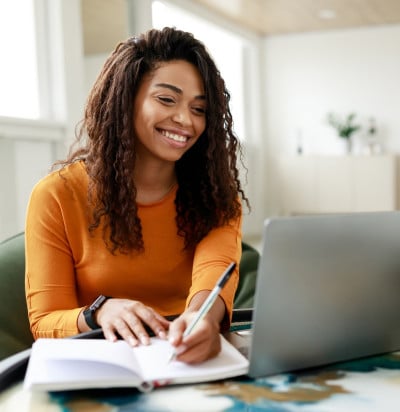 smiling young african american woman sitting