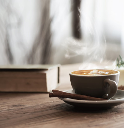 hot coffee cup set on wooden table