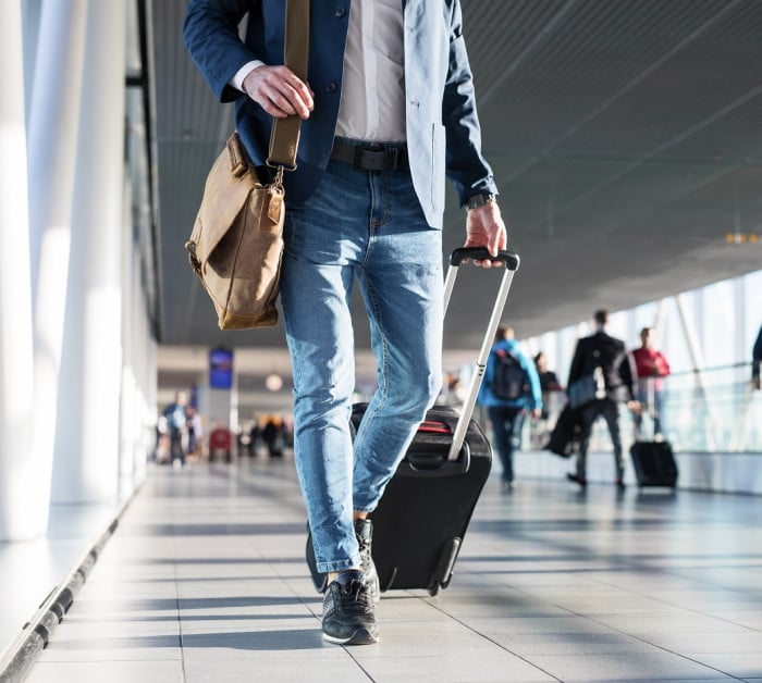 man shoulder bag hand luggage walking
