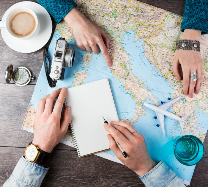 two young people together planning trip