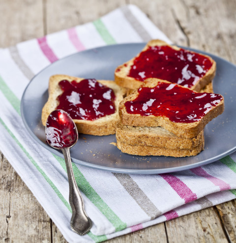 fresh toasted cereal bread slices on rustic wooden table