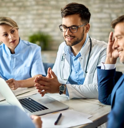 group healthcare workers businessman using laptop