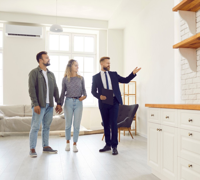 real estate agent giving clients tour