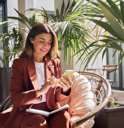 Business woman phone orange suit