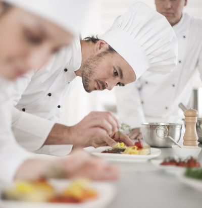 team preparing dishes professional kitchen