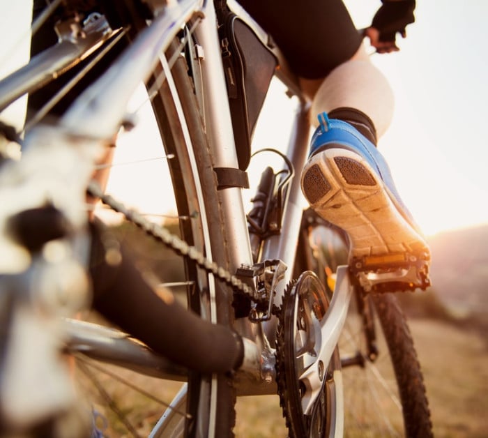 detail cyclist man feet riding mountain