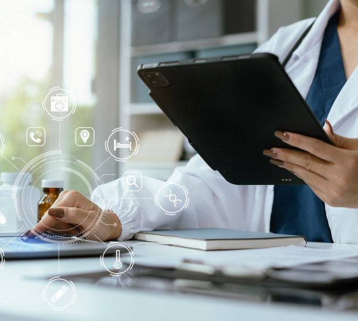 doctor working on laptop computer tablet