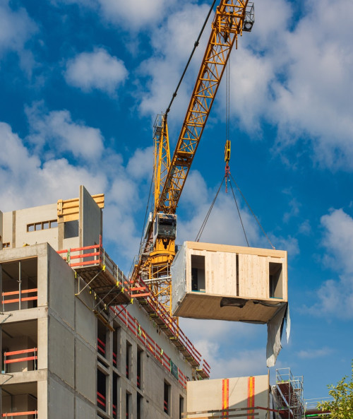 crane lifting wooden building module position