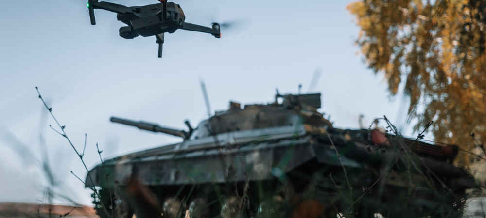 drone flying above tank background nature