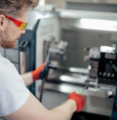 engineer man work on cnc machine