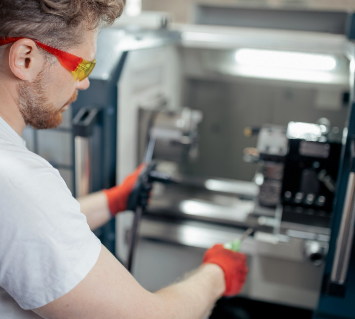 engineer man work on cnc machine