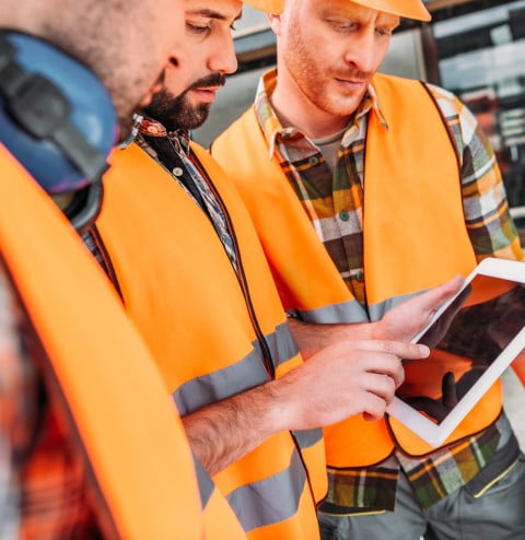 Construction workers using tablet