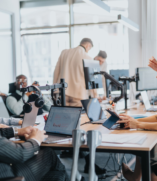 people in an office on computer
