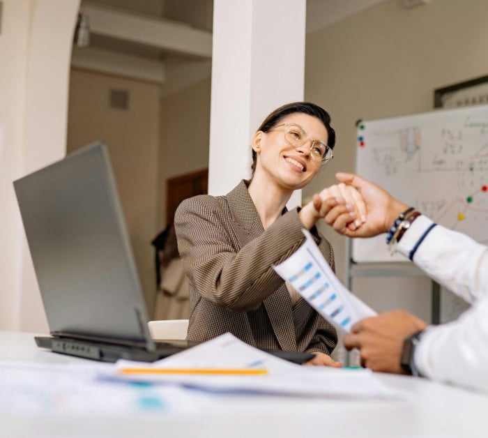 business handshake in a modern office meeting