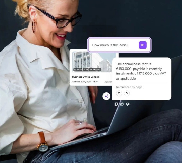smiling woman working on laptop with real estate chat interface